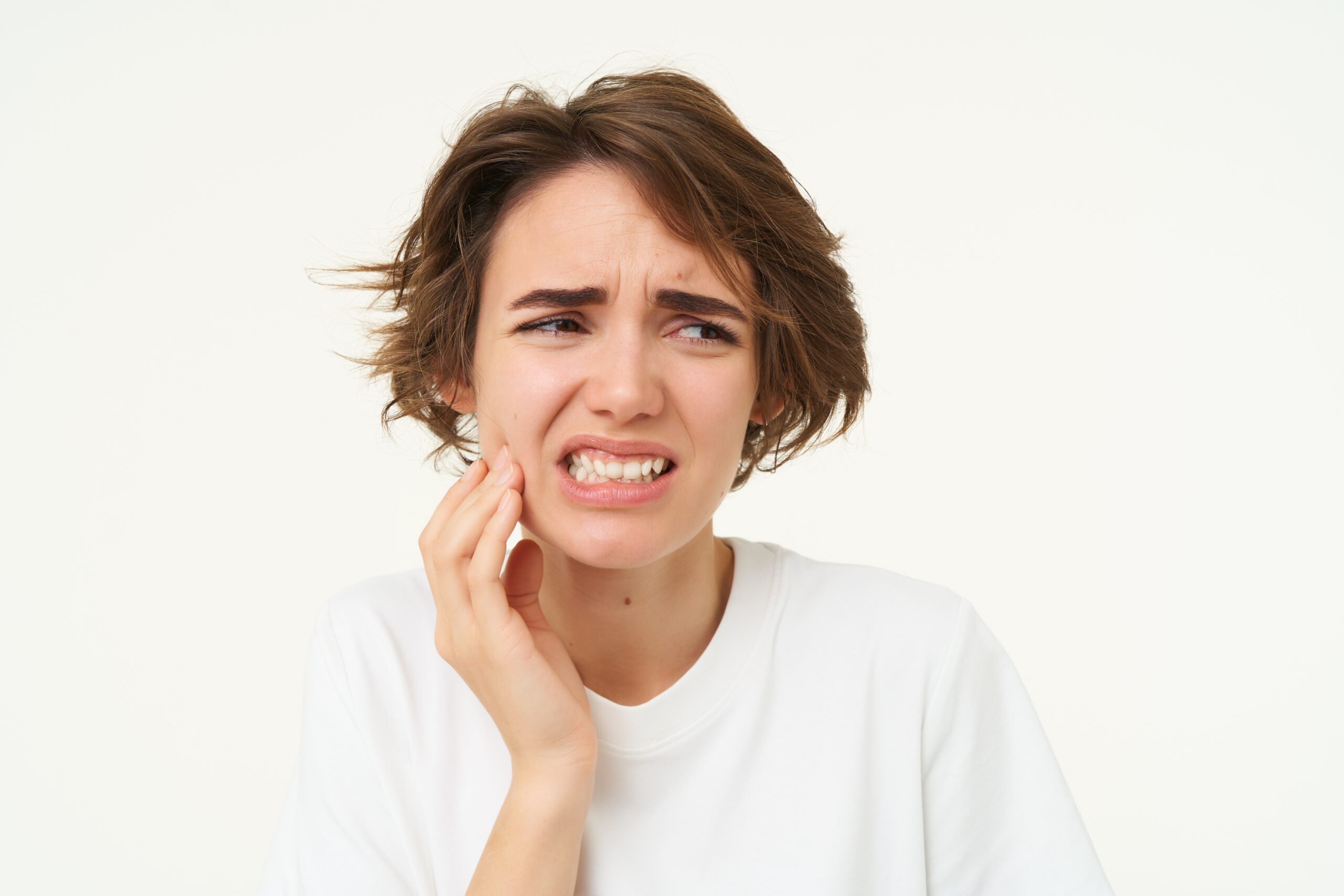 A woman who's teeth hurt when chewing