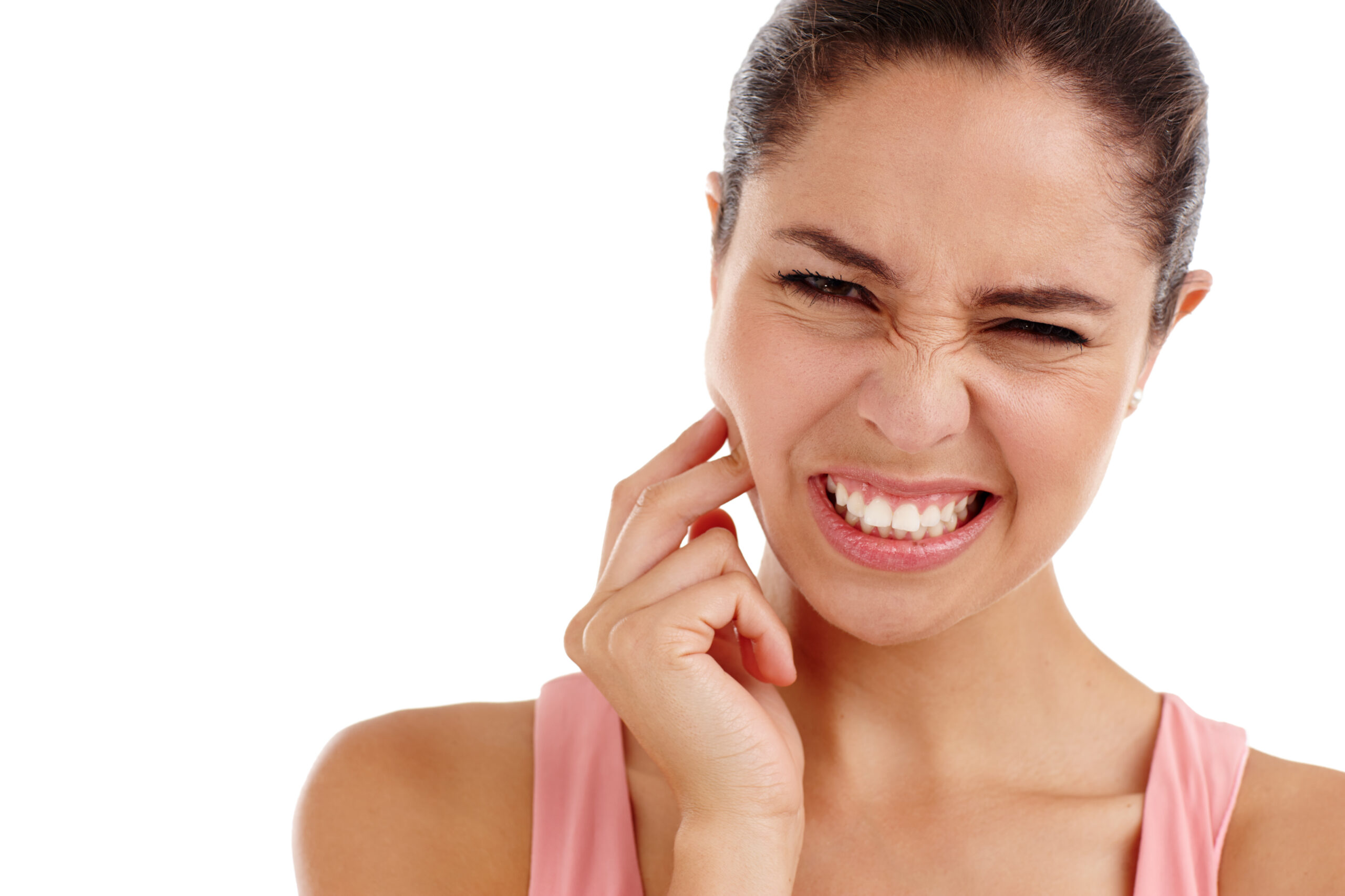 A woman experiencing tooth and ear pain on the same side