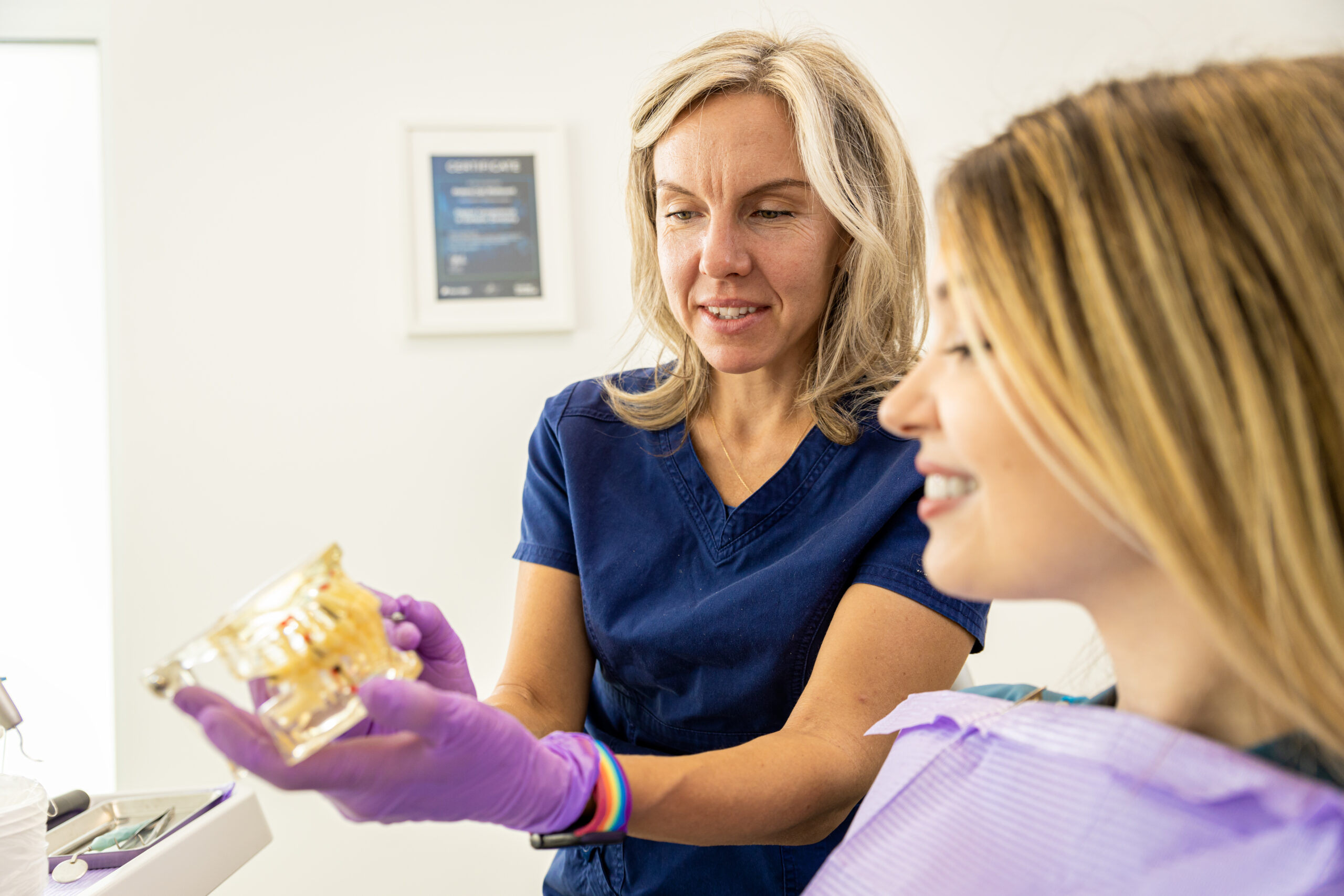 A patient asking a dentist how much do dental crowns cost.