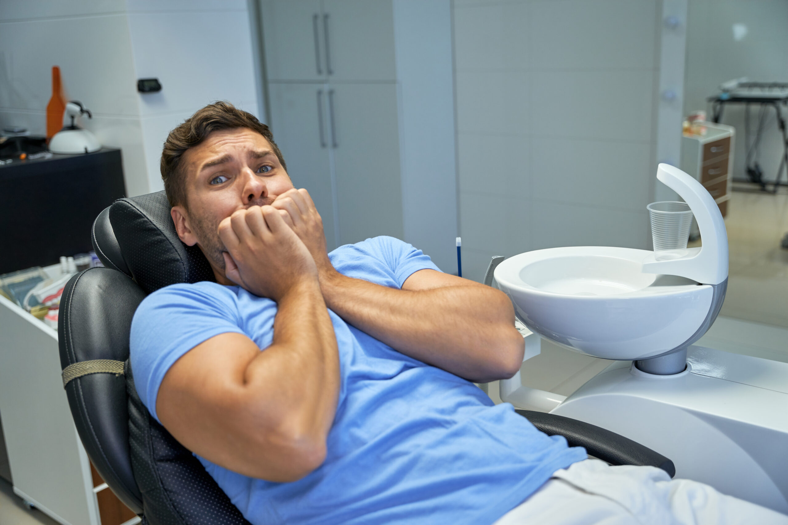 A male patient worrying, "will my dentist take payment plans?"