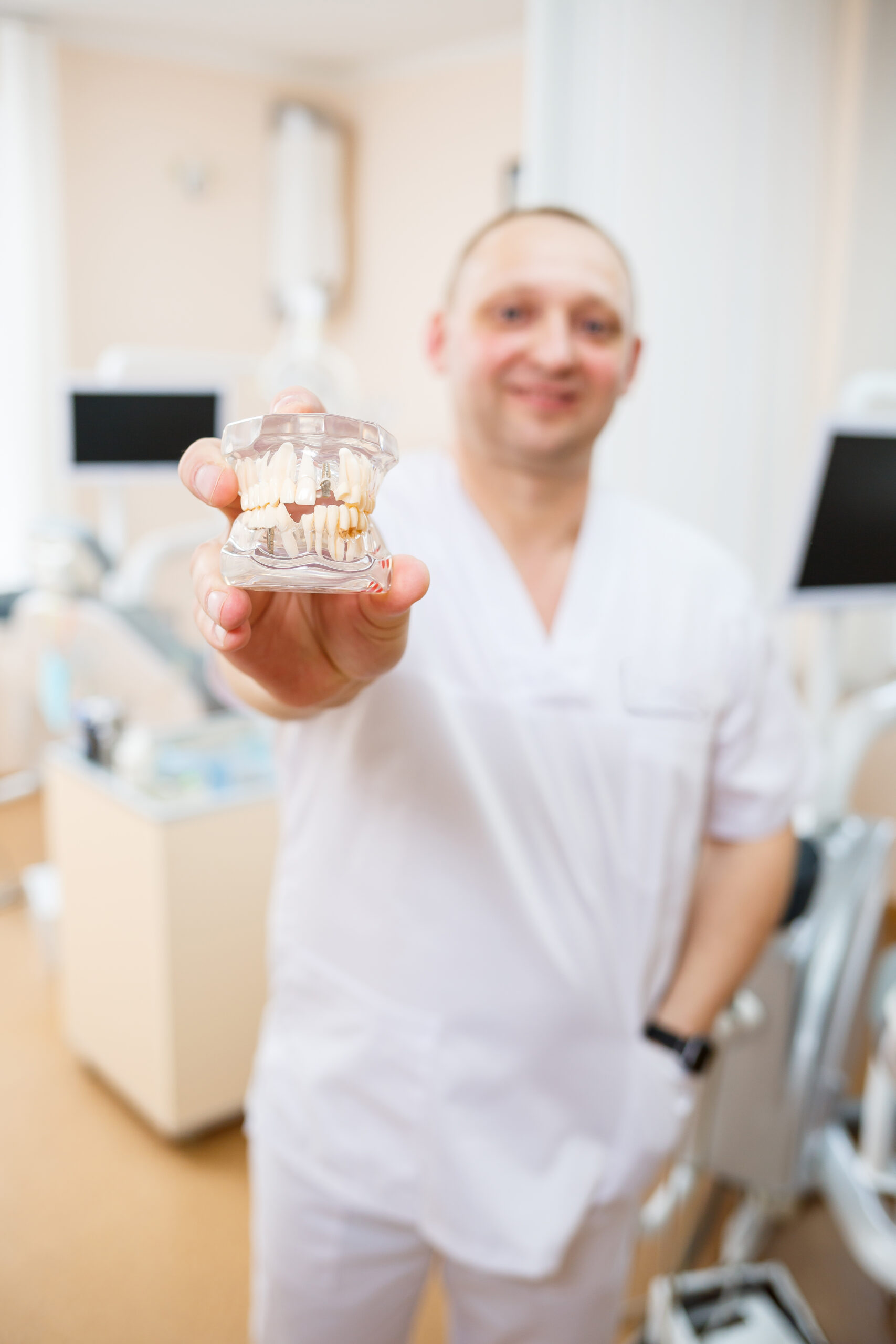 A dentist explaining the tooth crown price.