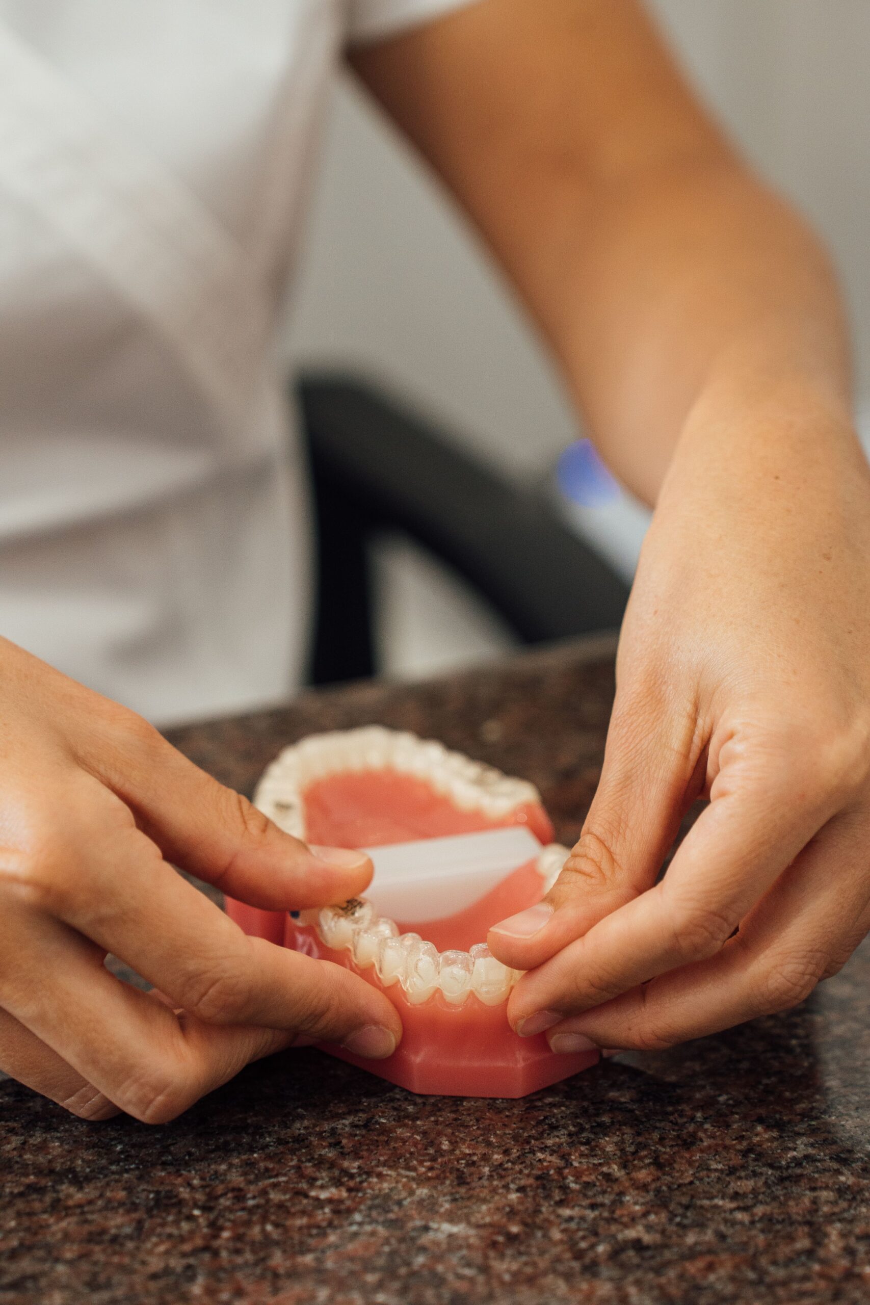 Denture repair being performed by a dentist.