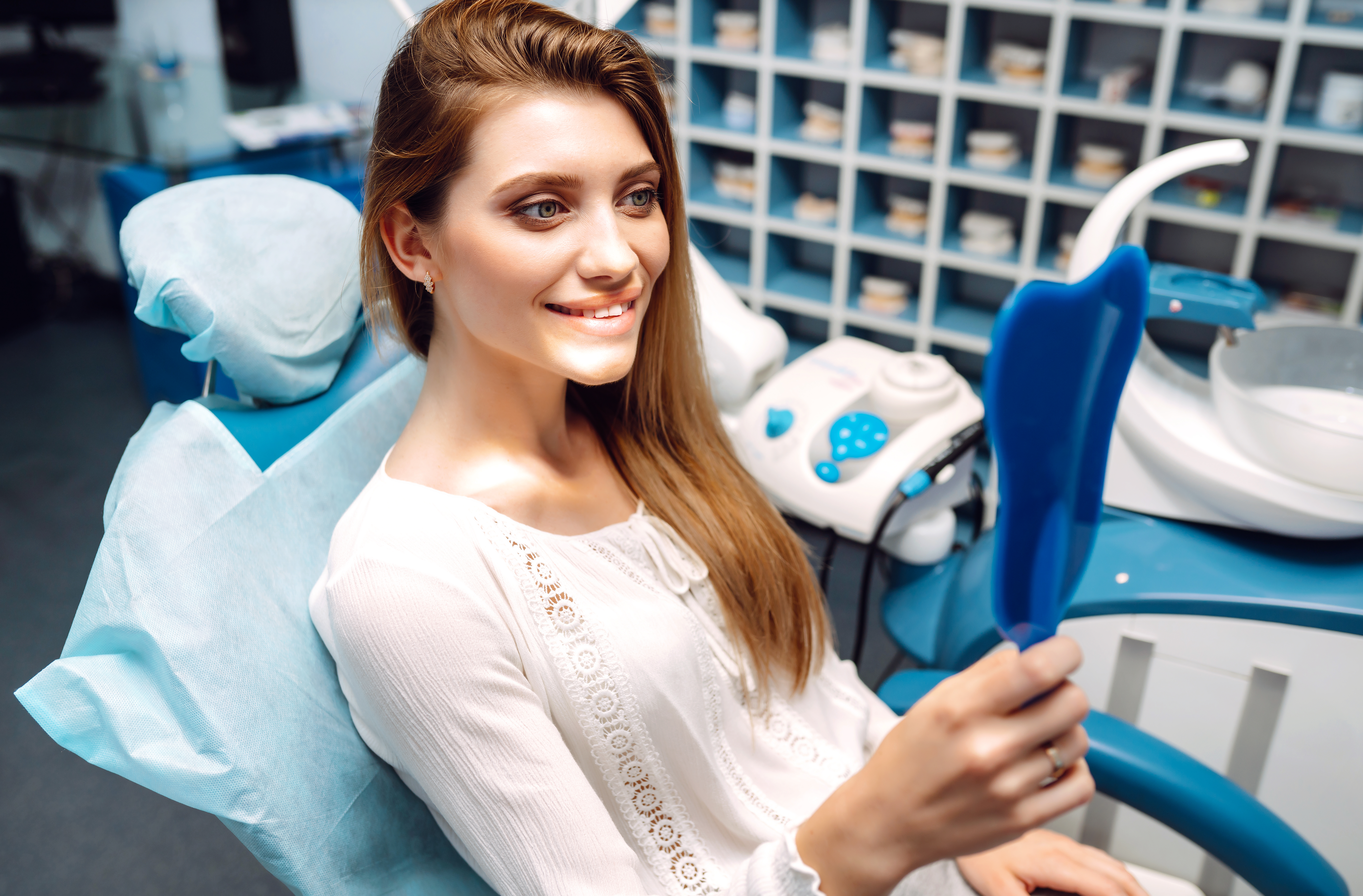 A woman happy after having intrinsic stains removed.
