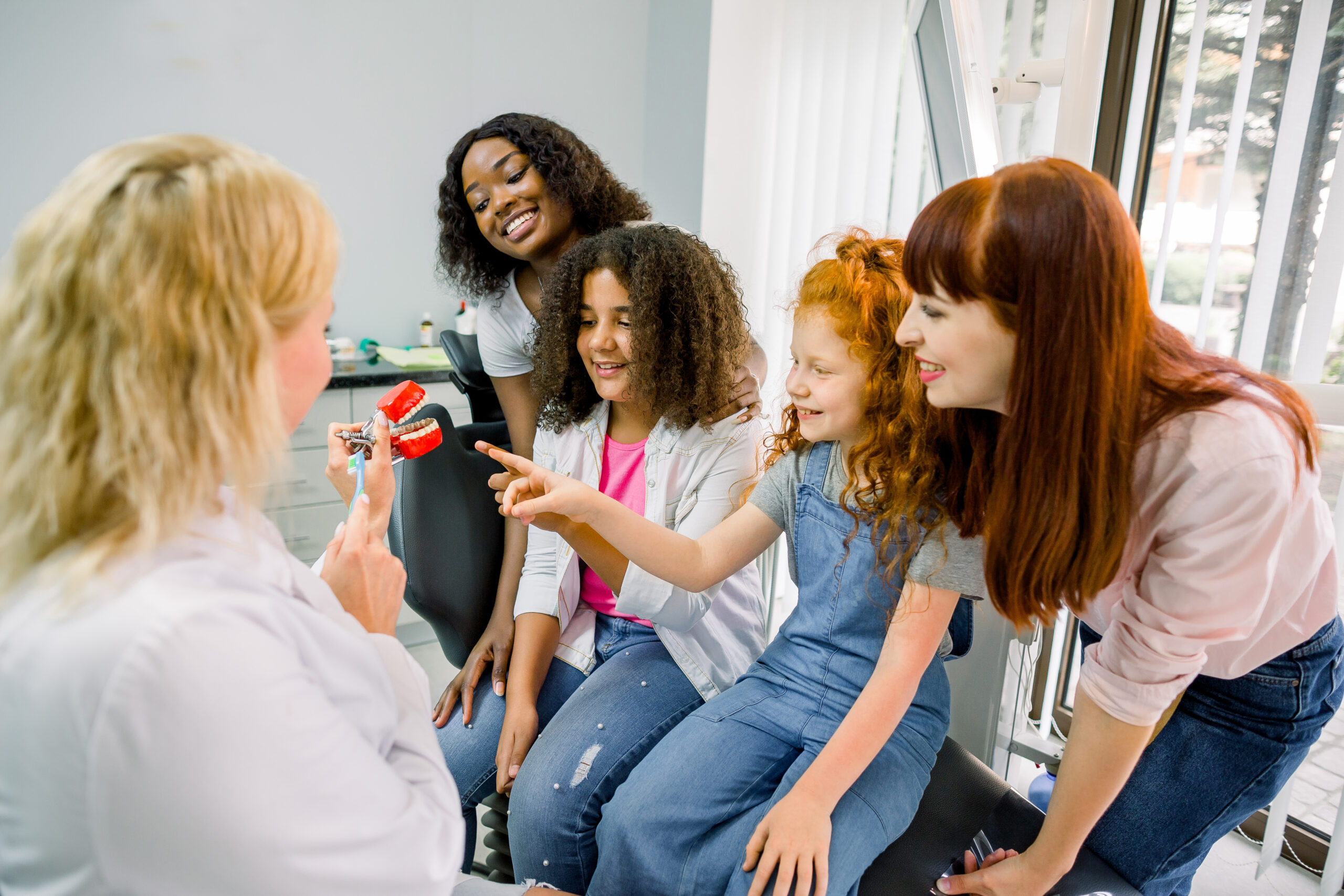 Patients learning the minimum age for teeth whitening.