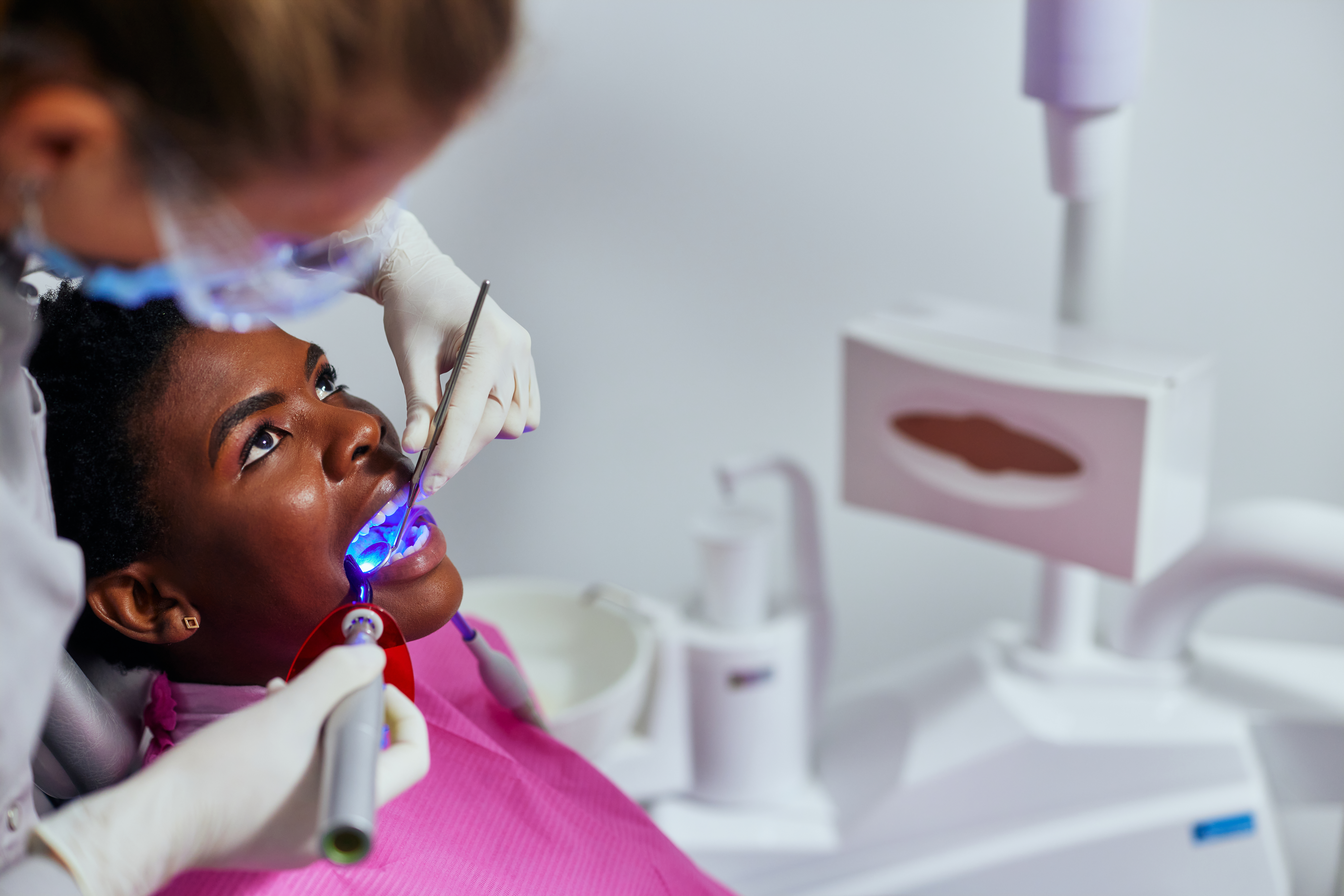 A woman receiving laser teeth whitening in San Jose.