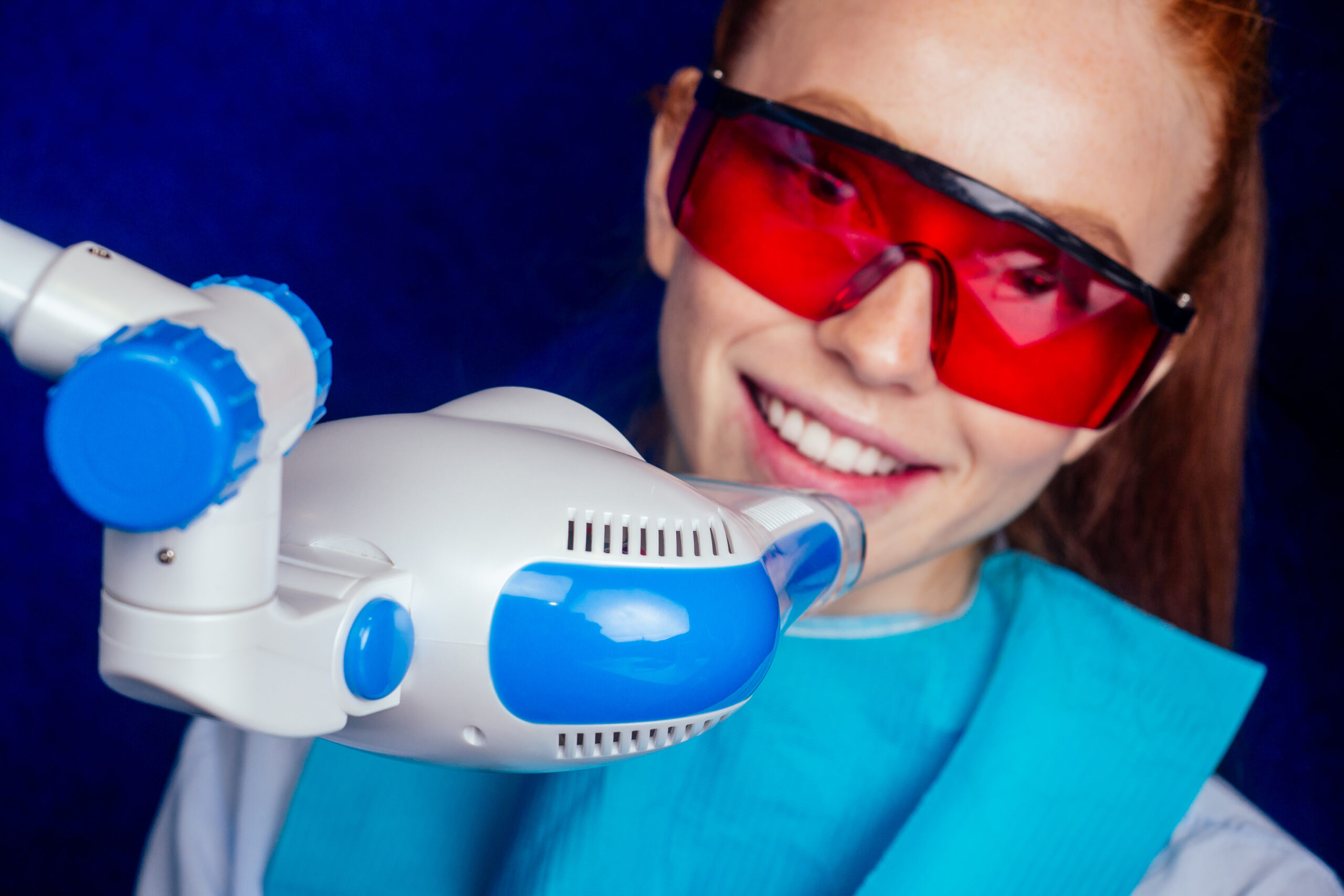 A woman receiving teeth whitening in Burlington, VT.