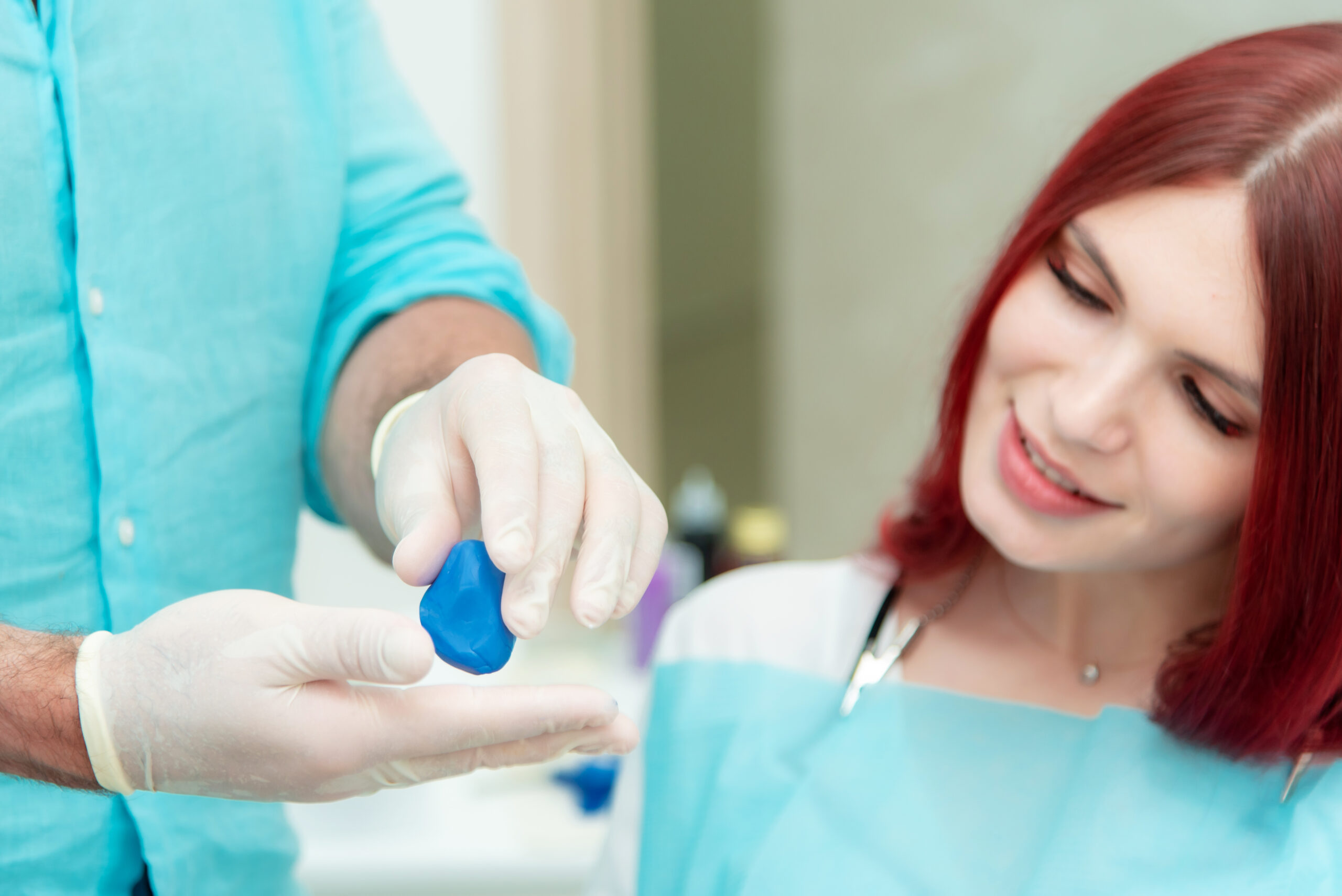 A woman learning how to remove tooth stains.